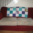 Finished quilt on the sofa - brightens up the room!
