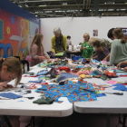 table full of scraps for making crazy patchwork